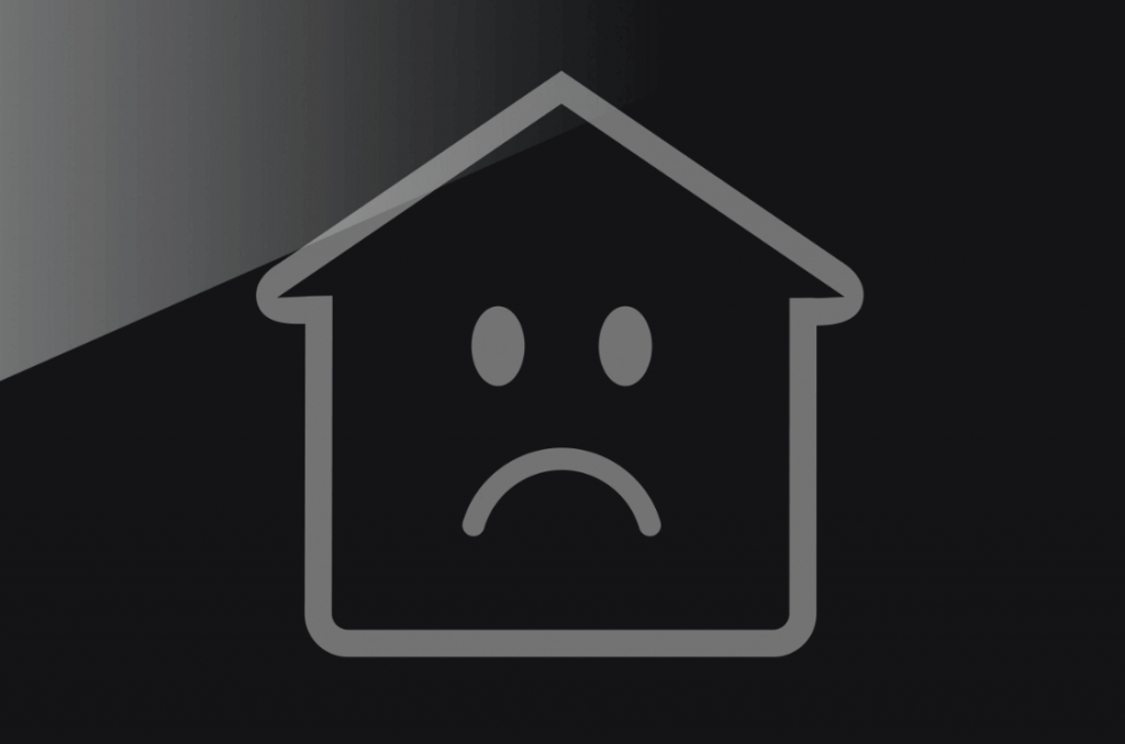 outline of house with a sad face